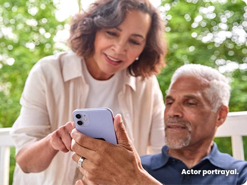 A couple using a cell phone
