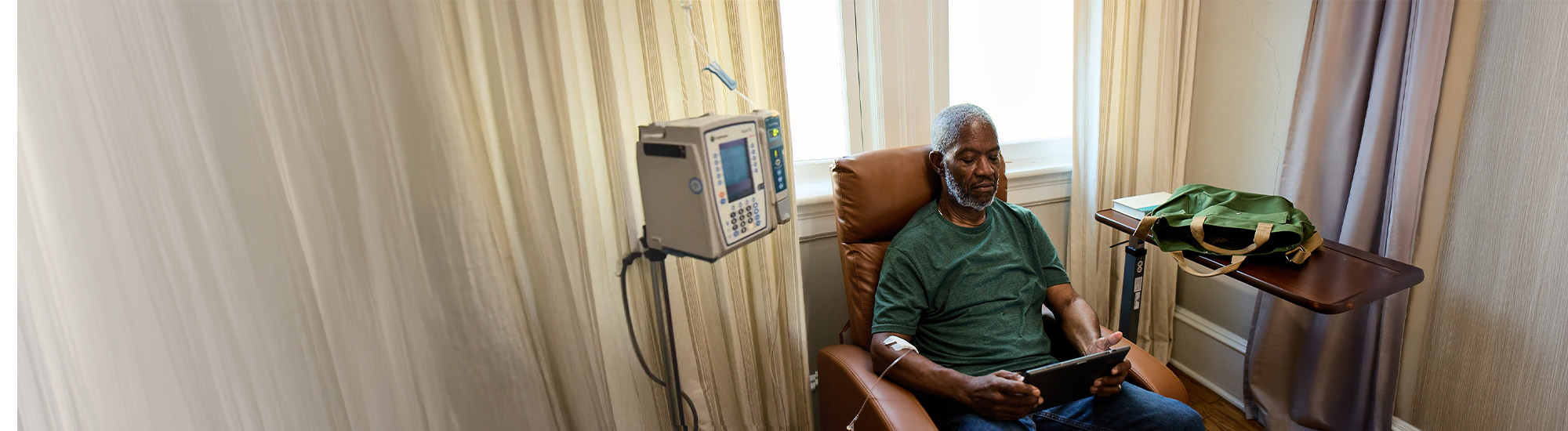 Bob sitting on a chair, waiting for his infusion