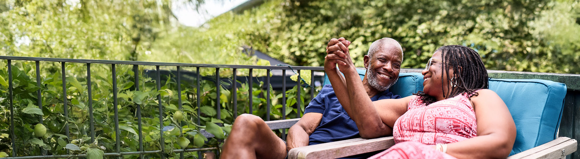 Bob and his wife, Cynthia, holding hands and smiling at one another