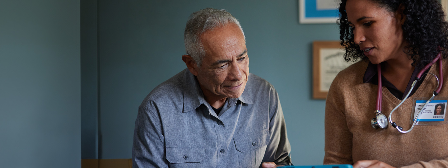 Richard, a patient living with early Alzheimer's, talking to a doctor
