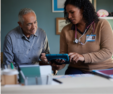 Richard, a patient living with early Alzheimer's, talking to a doctor