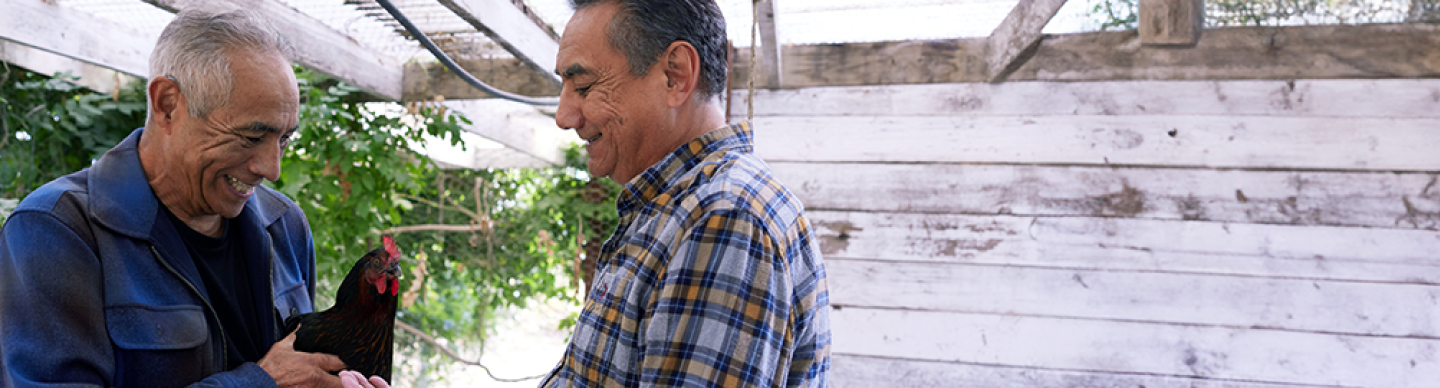 Richard, a patient living with early Alzheimer's, and his brother, smiling