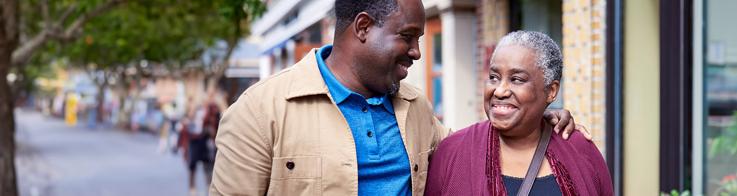 Audrey, a patient living with early Alzheimer's, and her son, Denver, on a walk