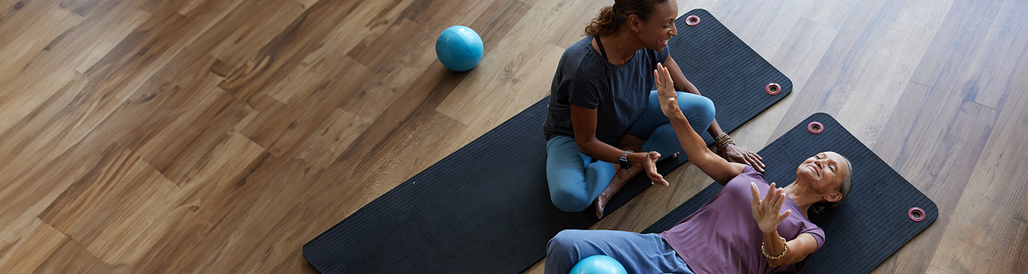 Paulette, a patient living with early Alzheimer's, and her daughter, Danielle, doing a workout