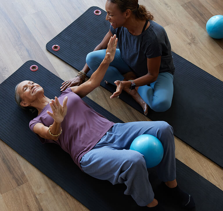 Paulette and her daughter, Danielle, doing a workout