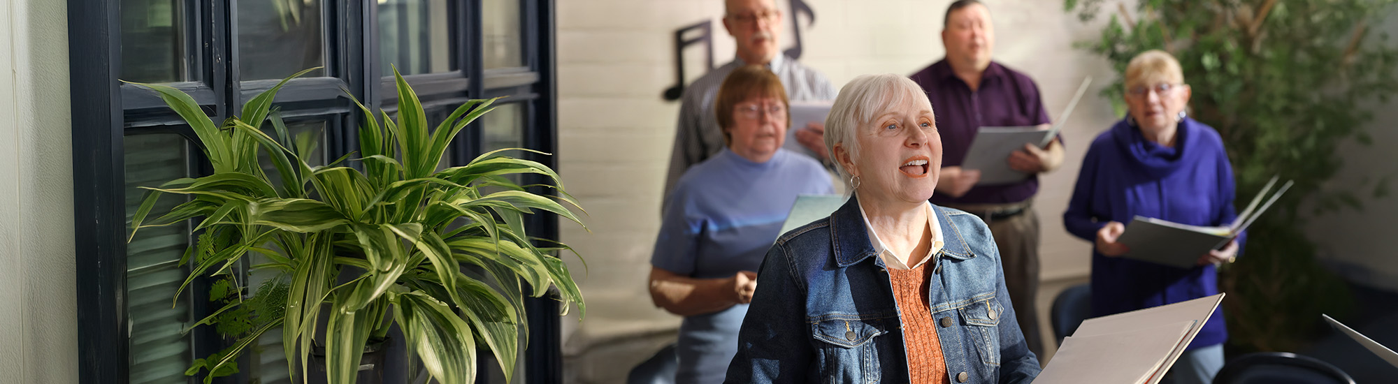 Nina with a group, singing