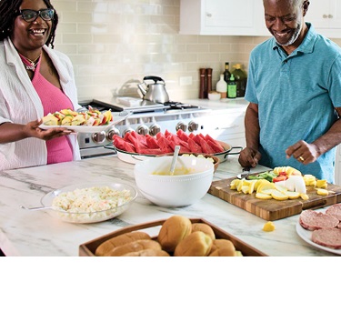 Bob and his wife, Cynthia, in the kitchen, smiling