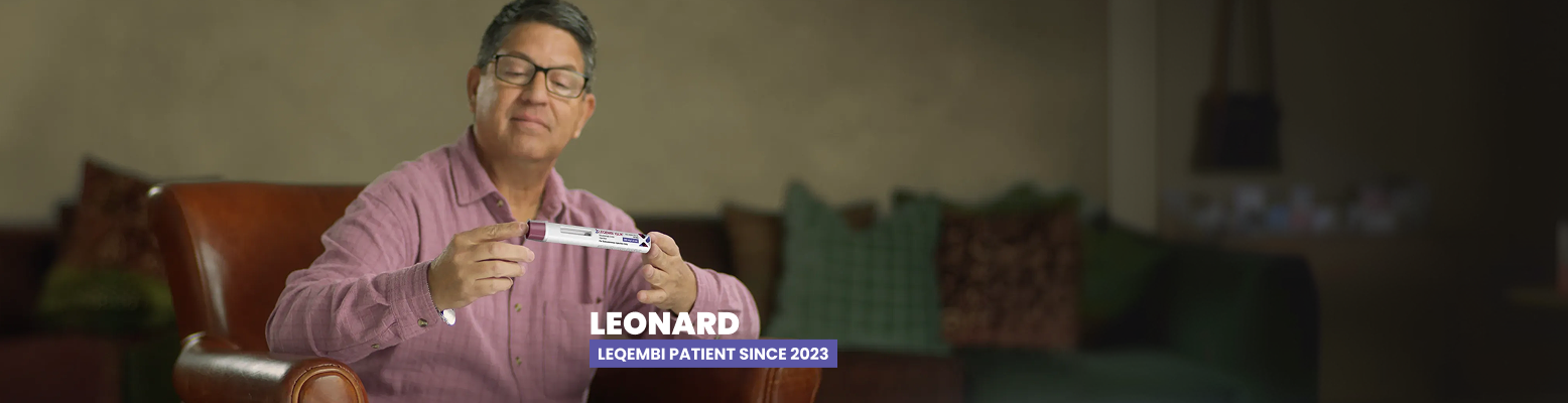 LEQEMBI® patient Leonard holding a LEQEMBI IQLIK™ autoinjector