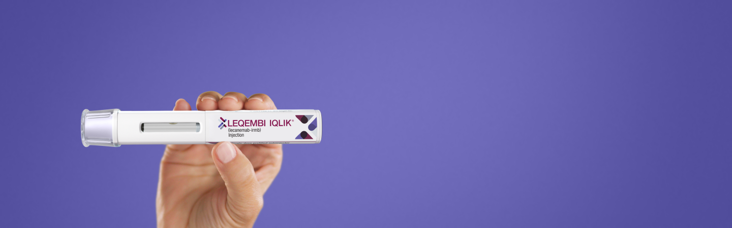 Hand holding an IQLIK® Autoinjector