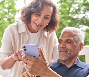 A couple using a cell phone